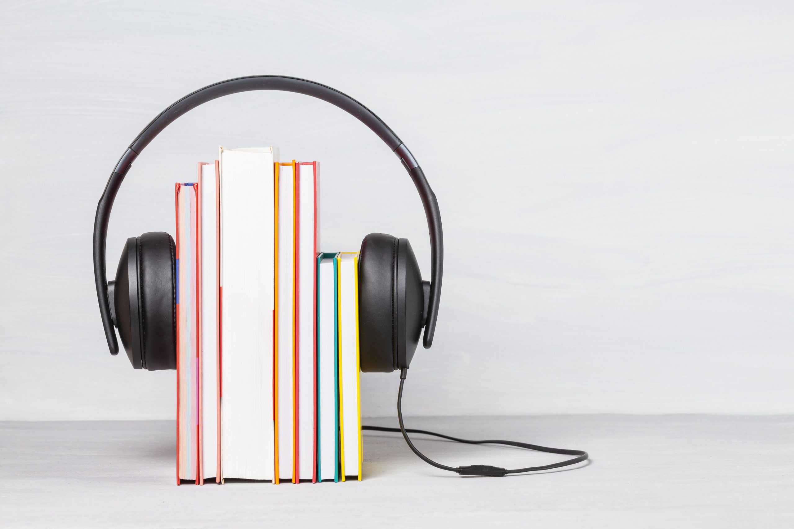 Group of books with the earphones. Audiobooks concept